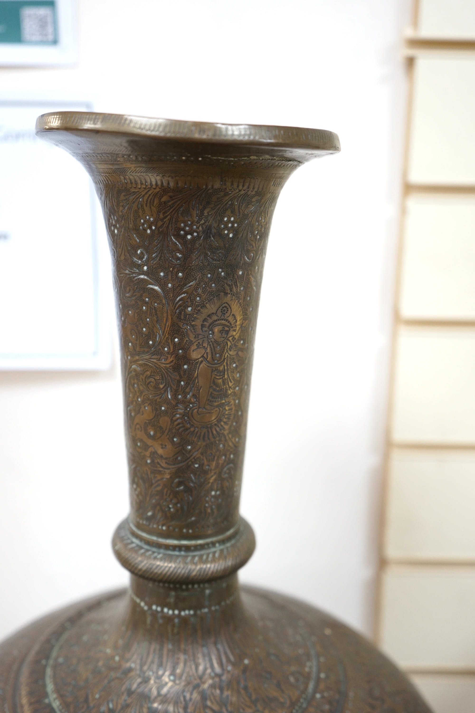 A large Indian repoussé work brass vase, 62cm high. Condition - good